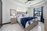 Guest Bedroom with King Bed and Pool View